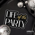 Load image into Gallery viewer, Photo Booth Prop with 'Life of the Party' text black and gold colors for celebrations, parties and more by Lush Party Studio logo.