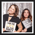 Load image into Gallery viewer, Two women holding photo prop signs with humorous phrases in front of a sparkly backdrop