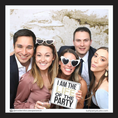 Load image into Gallery viewer, Group of people posing with photo booth prop sign that reads 'I am the life of the party'