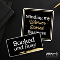 Load image into Gallery viewer, Two black and gold photo booth prop signs with 'booked and busy' text for business events