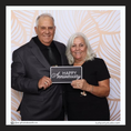 Load image into Gallery viewer, Man and woman holding a 'Happy Anniversary' sign by lushpartystudio