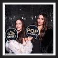 Load image into Gallery viewer, Two women holding wedding photo booth props by lush party studio