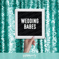 Load image into Gallery viewer, Hand holding a photo prop sign with 'Wedding Babes' text by Lush Party Studio branding.
