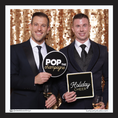 Load image into Gallery viewer, Two men in suits holding 'Pop the Champagne' and 'Holiday Cheer' prop signs