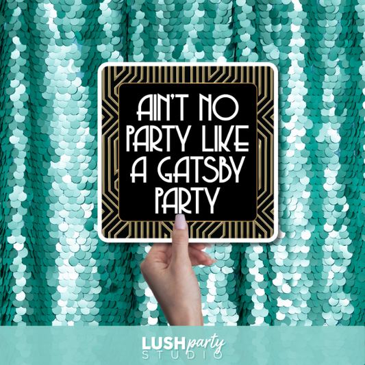 prop sign with 'Ain't no party like a Gatsby party' by Lush Party Studio branding.