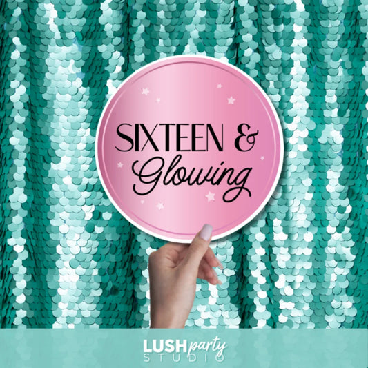 Photo prop sign with 'Sixteen & Glowing' text by Lush Party Studio.