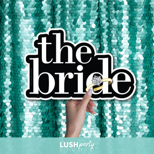 Prop sign with 'the bride' text by Lush Party Studio.