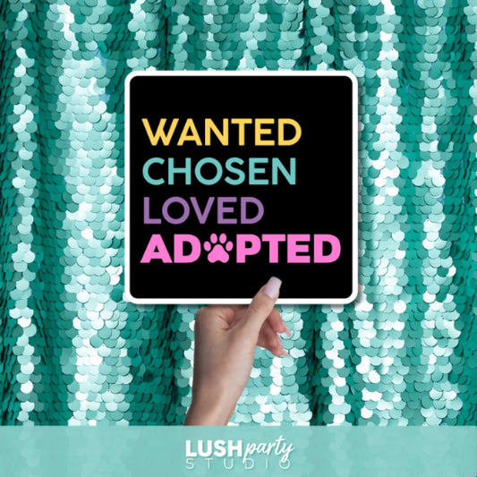 photo booth prop sign with 'WANTED, CHosen, Loved, Adopted' text by lush party studio