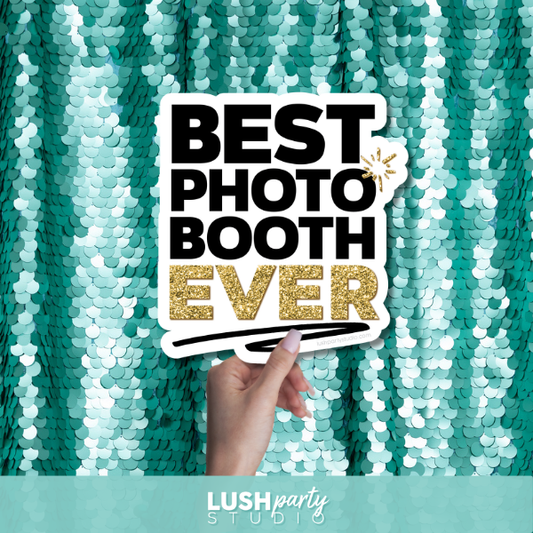Hand holding a 'Best Photo Booth Ever' sign against a teal sequin backdrop with Lush Party Studio branding.