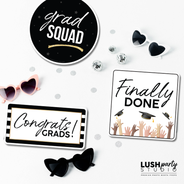 Graduation-themed photo booth props with 'grad squad', 'Finally Done', and 'Congrats Grads!' signs by Lush Party Studio.