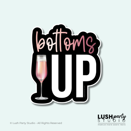 Photo booth prop with 'bottoms up' text and a champagne glass by Lush Party Studio.