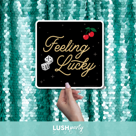 Casino theme photo booth prop sign with 'Feeling Lucky' text by lush party studio