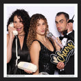Load image into Gallery viewer, Three people posing with cheers prop in a photo booth 
