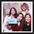 Load image into Gallery viewer, Four people posing with a photo booth prop sign by lush party studio
