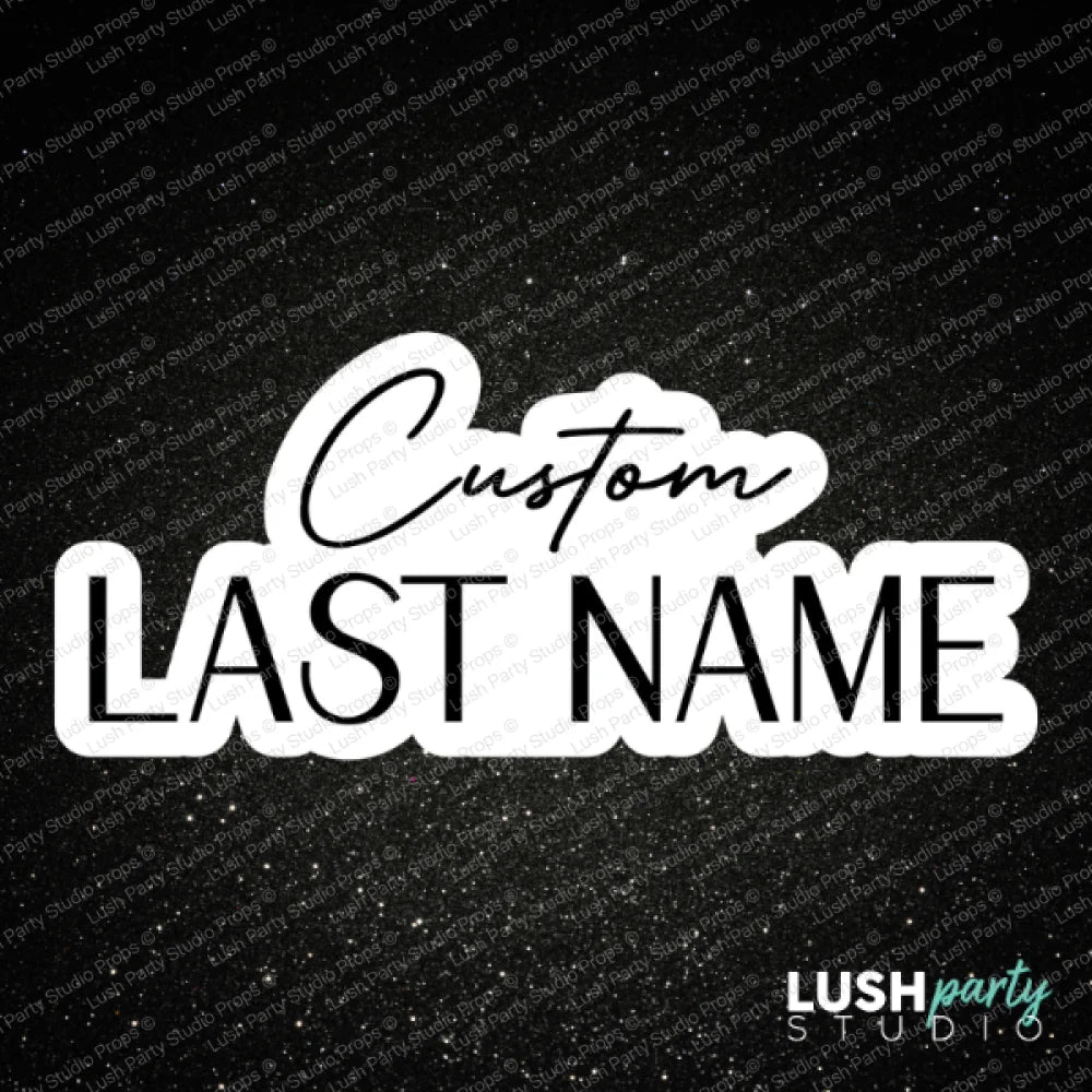 A black satin fabric background with white text reading 'LAST NAME CUSTOM PROPS' at the top and a larger central design reading 'Custom LAST NAME' in white and black. Small copyright text at the bottom reads 'Lush Party Studio - All Rights Reserved'.