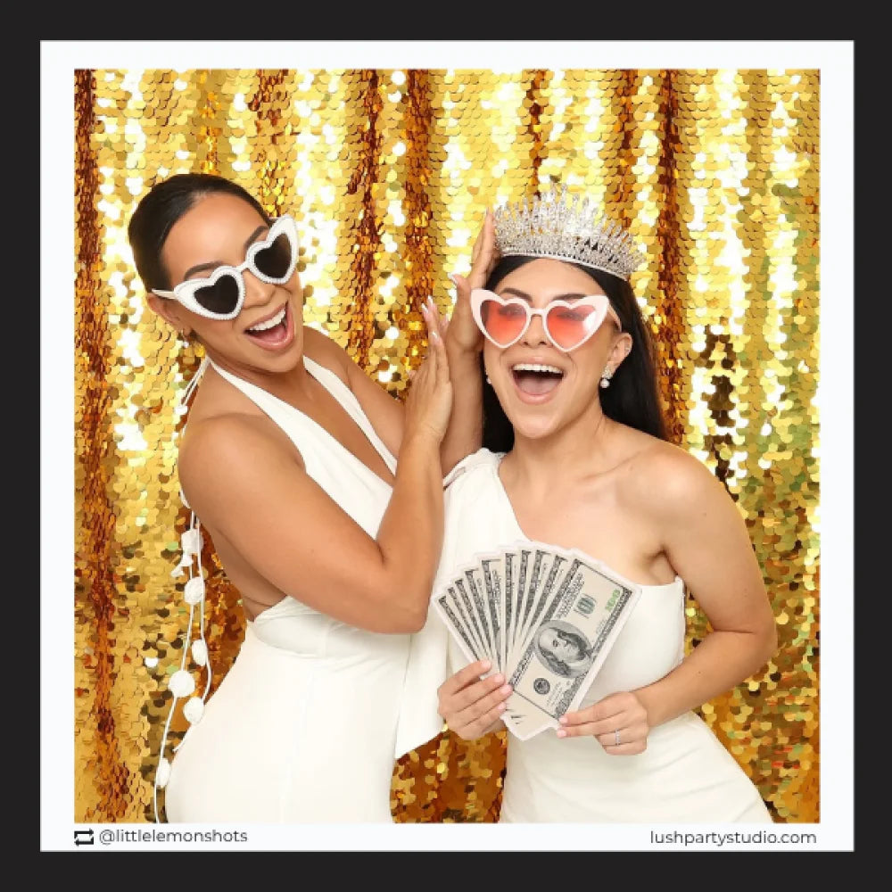 dollar bills fan prop and heart-shaped sunglasses