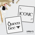 Load image into Gallery viewer, Two black and white photo booth prop signs with 'Queen bee' and 'Iconic' text by lush party studio
