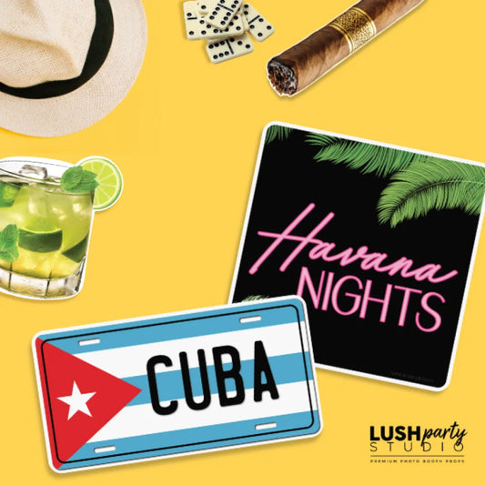 Cuba-themed photobooth props including a license plate, 'Havana Nights' sign, and mojito 