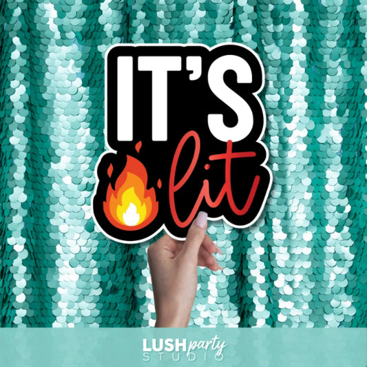 photo booth prop sign with 'IT'S lit' text by lush party studio