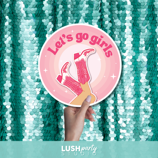 Prop sign with 'Let's go girls' text by Lush Party Studio.