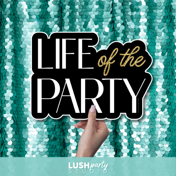 Photo booth prop sign with 'Life of the Party' text by Lush Party Studio.