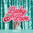 Load image into Gallery viewer, photo booth prop with 'Lucky in Love' text by Lush Party Studio 
