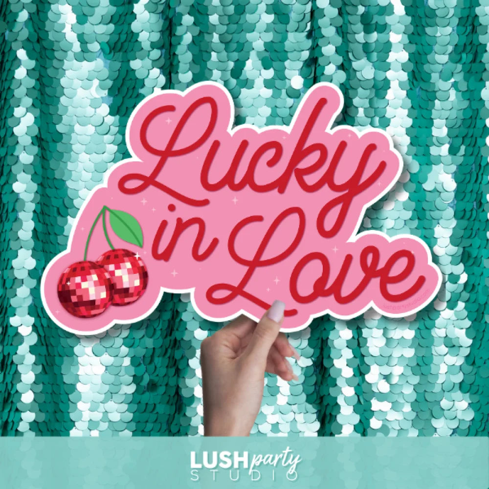 photo booth prop with 'Lucky in Love' text by Lush Party Studio 