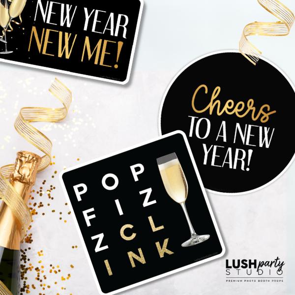 New Year's Eve photo booth props with champagne graphics and celebratory text by lush party studio