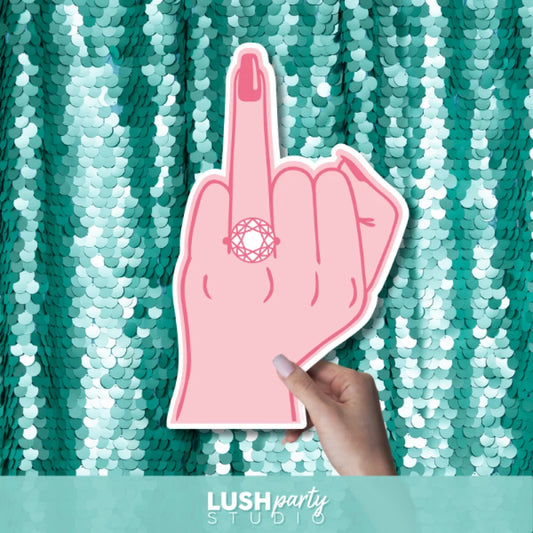 Pink finger with ring by Lush Party Studio.