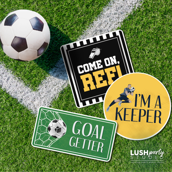 Soccer photo booth props on grass with a soccer ball