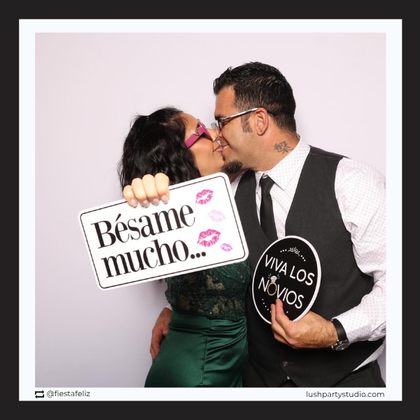 Two people kissing spanish wedding photo booth prop signs