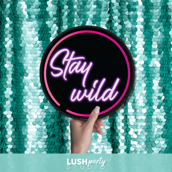 Neon prop sign with 'Stay wild' text by Lush Party Studio 