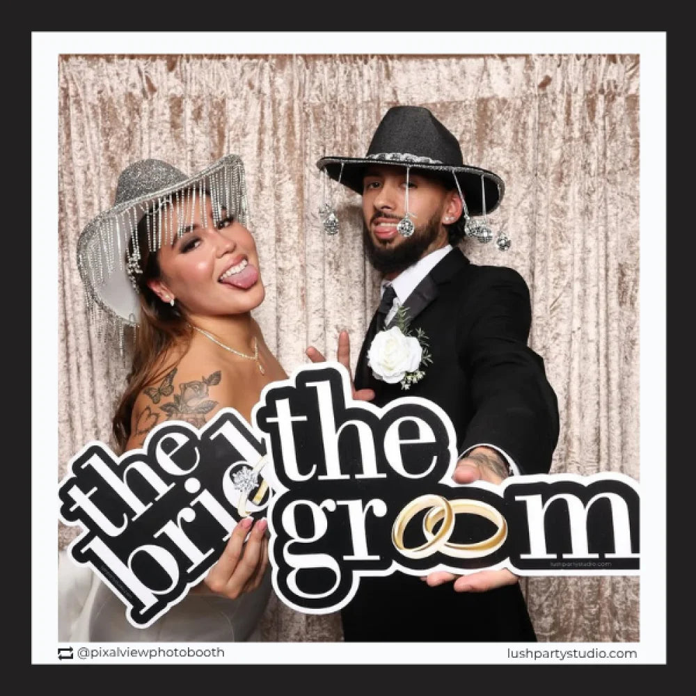 wedding photo booth with 'the bride' and 'the groom' props by lush party studio.