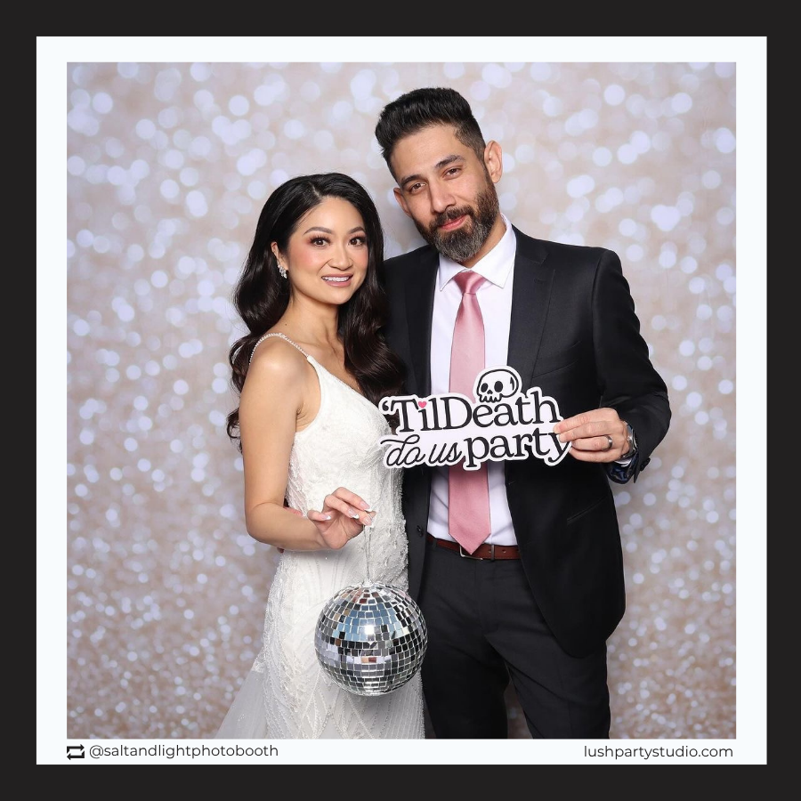 Bride and Groom with 'Til Death Do Us Party' prop sign by lush party studio