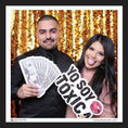 Load image into Gallery viewer, Two people posing with toxica photo booth prop sign by lush party studio
