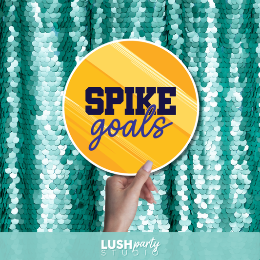 Photo prop sign with 'Spike goals' text by Lush Party Studio logo.