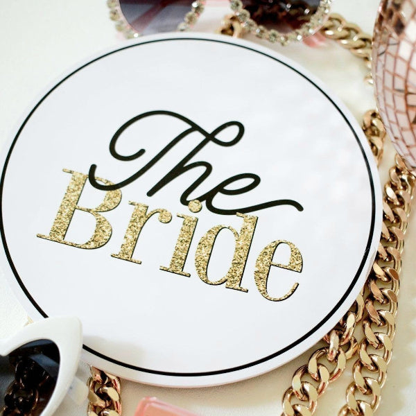 Round white sign with 'The Bride' text by lush party studio