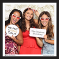 Load image into Gallery viewer, Three women posing with photo booth prop signs for colorful floral weddings, with a floral backdrop by lush party studio

