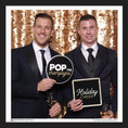 Load image into Gallery viewer, Two men in suits holding 'Pop the Champagne' and 'Holiday Cheer' prop signs
